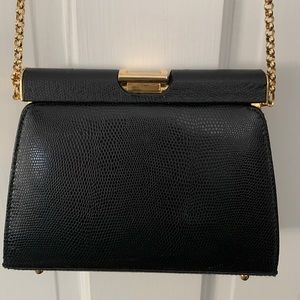 Black clutch or shoulder bag.